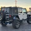 Horizontal photograph of a 2012JeepWranglerUnlimited Sport SUV 4D