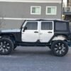 Horizontal photograph of a 2012JeepWranglerUnlimited Sport SUV 4D