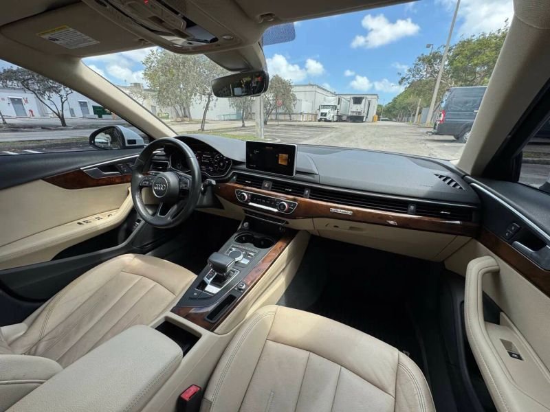 Horizontal photograph of a 2019AudiA4Premium Plus Sedan 4D