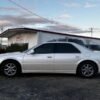 Horizontal photograph of a 2000CadillacSevilleSTS Touring Sedan 4D