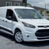 Horizontal photograph of a 2015FordTransit Connect CargoXLT Van 4D