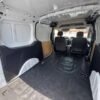 Horizontal photograph of a 2015FordTransit Connect CargoXLT Van 4D