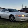 Horizontal photograph of a 2000CadillacSevilleSTS Touring Sedan 4D