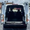 Horizontal photograph of a 2015FordTransit Connect CargoXLT Van 4D
