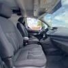 Horizontal photograph of a 2015FordTransit Connect CargoXLT Van 4D