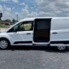 Horizontal photograph of a 2015FordTransit Connect CargoXLT Van 4D
