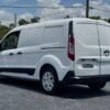 Horizontal photograph of a 2015FordTransit Connect CargoXLT Van 4D