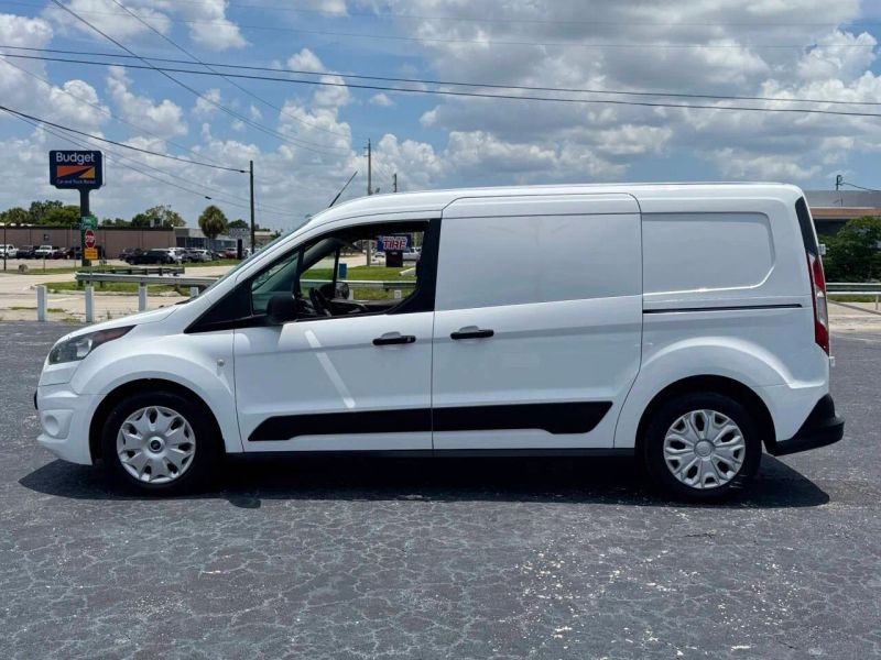 Horizontal photograph of a 2015FordTransit Connect CargoXLT Van 4D