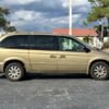 Horizontal photograph of a 2005ChryslerTown & CountryTouring Minivan 4D