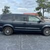Horizontal photograph of a 2014ChryslerTown & CountryS Minivan 4D