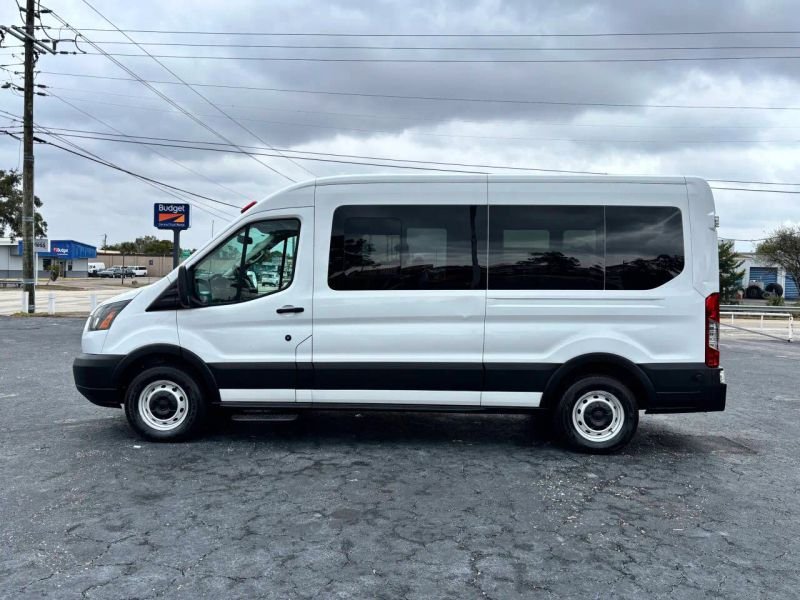 Horizontal photograph of a 2015FordTransit 150 VanMedium Roof w/Sliding Side Door w/LWB Van 3D
