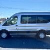 Horizontal photograph of a 2018FordTransit 150 WagonXLT w/Medium Roof w/Sliding Side Door Van 3D
