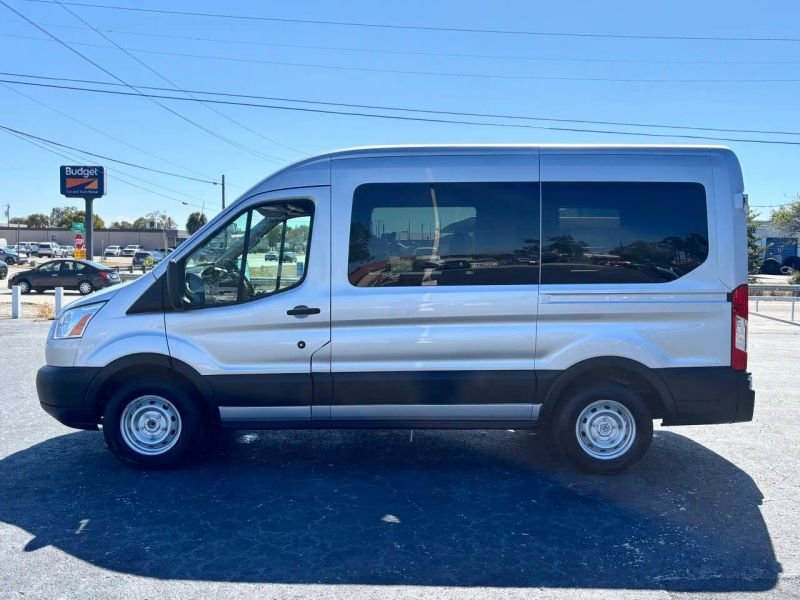 Horizontal photograph of a 2018FordTransit 150 WagonXLT w/Medium Roof w/Sliding Side Door Van 3D
