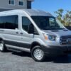 Horizontal photograph of a 2018FordTransit 150 WagonXLT w/Medium Roof w/Sliding Side Door Van 3D