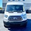 Horizontal photograph of a 2018FordTransit 150 WagonXLT w/Medium Roof w/Sliding Side Door Van 3D