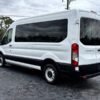 Horizontal photograph of a 2015FordTransit 150 VanMedium Roof w/Sliding Side Door w/LWB Van 3D