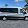 Horizontal photograph of a 2016FordTransit 350 WagonXLT w/Medium Roof w/Sliding Side Door Van 3D