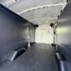 Horizontal photograph of a 2019FordTransit 150 VanMedium Roof w/Sliding Side Door w/LWB Van 3D
