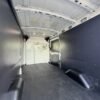 Horizontal photograph of a 2019FordTransit 150 VanMedium Roof w/Sliding Side Door w/LWB Van 3D